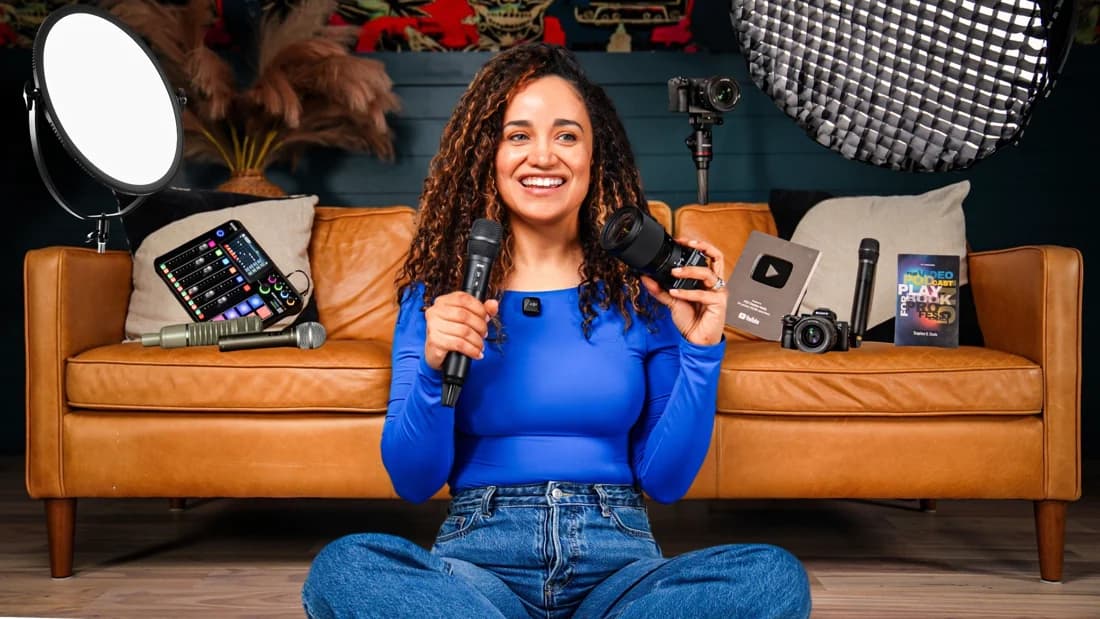 Veronica surrounded by cameras, microphones, lights, and recording equipment